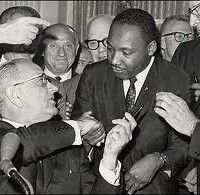 President Lyndon Baines Johnson gives the Rev. Martin Luther King, Jr., the pen he used to sign the 1964 Civil Rights Act.