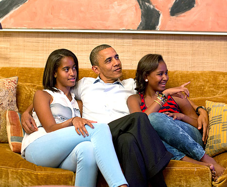 Malia, Dad, and Sasha hanging out together.