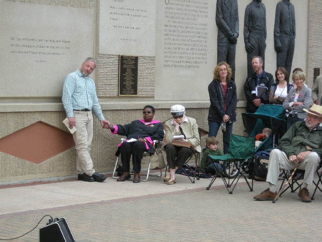 I'm holding hands with Virginia Huston, a descendant of Elmer Jackson. She was the first representative of the lynching victims to be at the memorial.