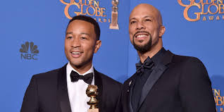 John Legend (L) and Common accept their Academy Award