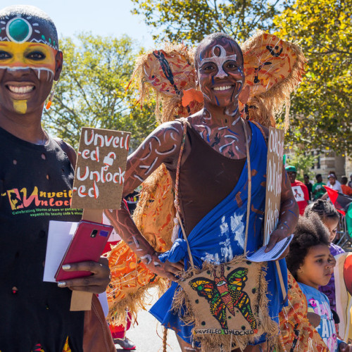 (Photo by Albin Lohr-Jones/Pacific Press/LightRocket via Getty Images) Parade participants march with a tribal themed group wearing colorful face paint. The 46th Annual African-American Day Parade was held in Harlem; the spectators, politicians and prominent members of Harlem's black community celebrated the historically-rich NYC community of those from different African heritages.