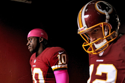 Washington Redskins quarterbacks Robert Griffin III (L) and Kirk Cousins.