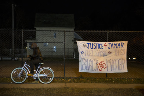 A protest sign in Minneapolis, photographed hours before gunmen opened fire on a predominantly Black crowd.