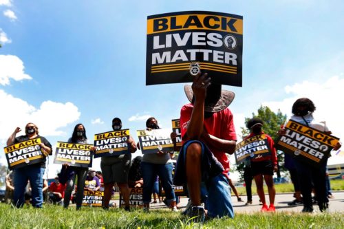 Racial Injustice Labor Unions BLM supporter takes a knee