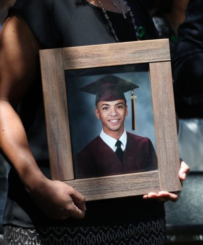 Photo of Miles Hall in his mother's (Taun Hall) hands.