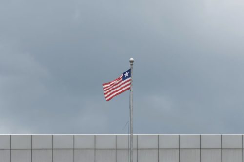 The flag in Liberia with a cloudy background.