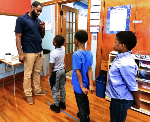 Jarvis Ragland lines up his class for a bathroom break. At the start of the year, Ragland instituted a "brotherhood" standard. "I told them as brothers, we are not supposed to fight each other."