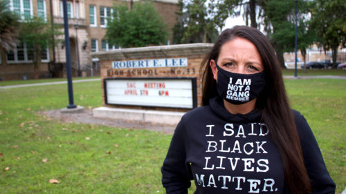 Photo by Evac Movement: Teacher Amy Donofrio stands outside Robert E. Lee High School in Jacksonville, Florida.