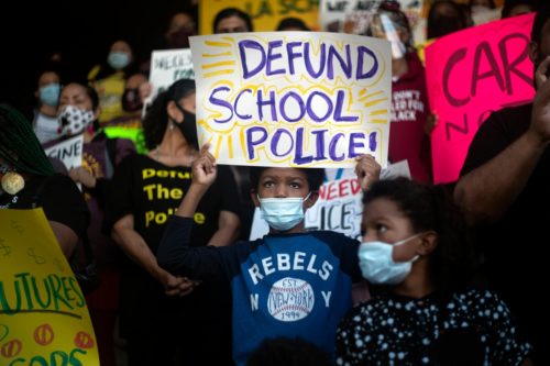 Channing Flagg holds a sign during a news conference held by Students Deserve outside the Los Angeles Unified School District office on June 3, 2021. (Photo by Hans Gutknecht/MediaNews Group/Los Angeles Daily News via Getty Images)