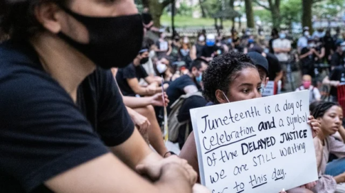 Juneteenth A protestor holds a sign about the significance of Juneteenth (Twitter/@TheHill)