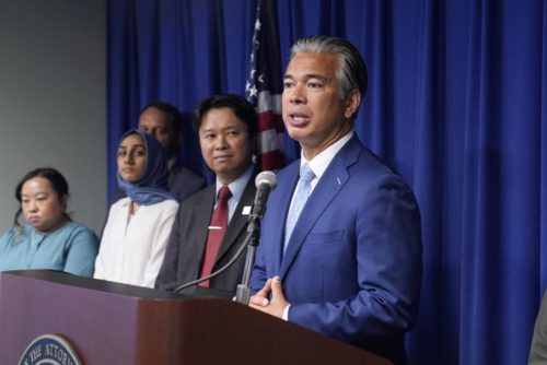 California Attorney General Rob Bonta, right, discusses the rise in hate crimes in California, Tuesday, June 28, 2022. (AP Photo/Rich Pedroncelli)