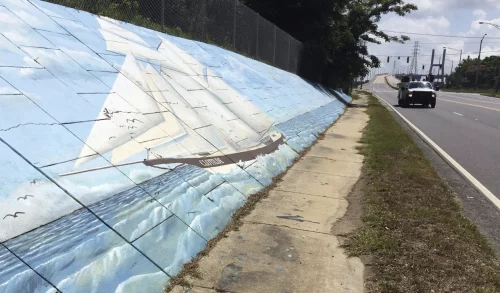 A mural of the Clotilda decorates Africatown Boulevard in Mobile, Alabama. (Kevin McGill / AP file)