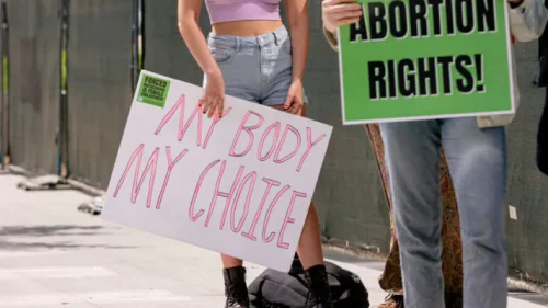 Protestors hold pro-choice signs in Los Angeles following the overturning of Roe v. Wade on Wednesday, July 6, 2022. (Wesley Lapointe / Los Angeles Times via Getty Images)