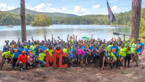 Campers pose on the breach at Melanated Campground