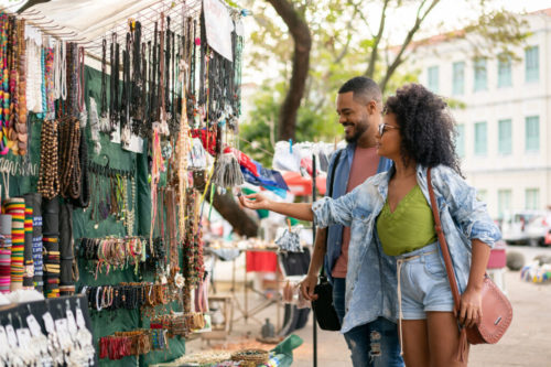 A Black couple browses jewelry in space that may be similar to Boston's upcoming outdoor market (IStock/MesquitaFMS)