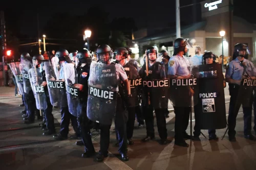 Police confront demonstrators protesting the acquittal of former St. Louis police officer Jason Stockley in Sept. 2017. (Scott Olson / Getty Images file)