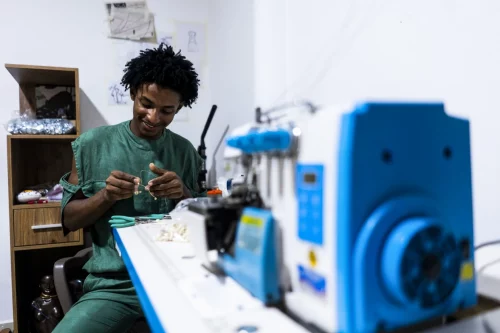 Esteban Sinisterra Paz works in his workshop in his apartment in Cali, Colombia (Charlie Cordero for The Washington Post / via Getty Images file)