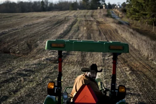 John Boyd, president of the Black Farmers Association, plants winter wheat in one of his fields in Baskerville, Va. (Melina Mara / The Washington Post via Getty Images file)