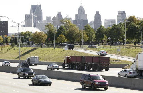 Cars drive on I-375, which divided a neighborhood, near downtown Detroit. (Paul Sancya / AP file)