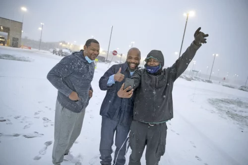 Termaine Hicks, center, celebrates with his brothers Tone Hicks and Tyron McClendon after he was released from SCI Phoenix Prison in 2020. (Jason E. Miczek / AP for The Innocence Project)