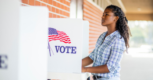 A young Black woman at a polling booth