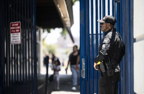 221228-richman-elementary-school-police-mjf-1741-059d84 A Fullerton police sergeant stands near the entrance to Richman Elementary School in Fullerton, Calif., on May 25. (Paul Bersebach / Orange County Register via Getty Images)