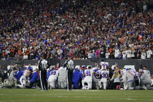 The Buffalo Bills players pray for teammate Damar Hamlin during the first half of an NFL football game against the Cincinnati Bengals, Monday, Jan. 2, 2023, in Cincinnati. (AP Photo/Jeff Dean)