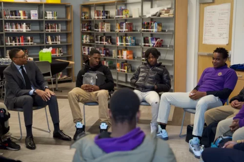 At Ron Brown College Preparatory High School in Northeast, a dozen young men sat down with Becoming A Man affiliates from D.C. and Chicago and D.C. Public Schools Chancellor Lewis D. Ferebee to watch a classic episode of "The Fresh Prince of Bel-Air" and discuss the themes surrounding it. (Marckell Williams/The Washington Informer.)