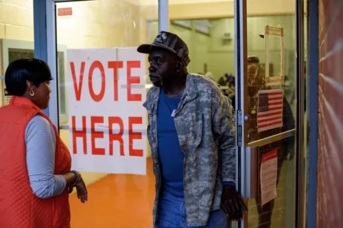 Voters leave a polling station at a National Guard base during the presidential primary in Camden, Ala., on March 3, 2020. (Joshua Lott / AFP via Getty Images file)