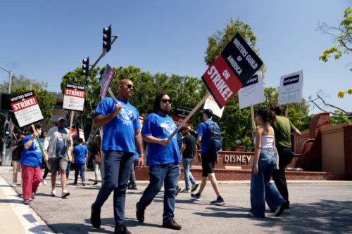 WGA supporters on a picket line outside Disney Studios in Burbank, Calif., on May 8. (Eric Thayer / Bloomberg via Getty Images file)