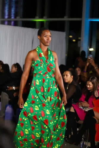 2-1 Asiha Grigsby floats down the runway in a custom dress. Credit: Photo courtesy of Darrell Stoney Sr.