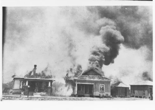 White perpetrators set the Greenwood district known as Black Wall Street on fire in 1921 (The Oklahoman/University of Tulsa McFarlin Library Archives)