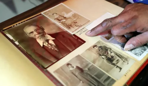 Ramont Wright looks at a photo of the great grandfather after whom he was named. (Jeff Lange, Akron Beacon Journal)