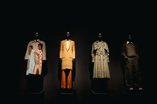 download The current exhibition at New York's Metropolitan Museum of Art, "Superfine: Tailoring Black Style" is organized into 12 conceptual and chronological groupings. On display here is the "Heritage" category blending African dress with Western tailoring traditions. (Adrianna Newell for NPR)
