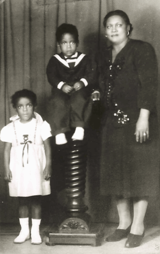 My mother, Ana Alvarez (age 4), my uncle, Gilberto Alvarez (age 2), and my grandmother, Isabel Navedo-Alvarez (age 42). Harlem, NY (El Barrio)