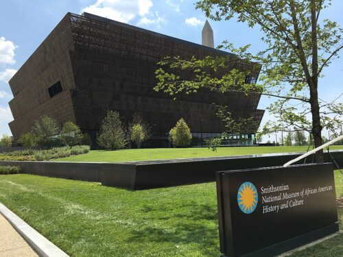 Smithsonian-nmaahc-outside-20160720 Exterior of the Smithsonian National Museum of African American History and Culture, July 20, 2016 (Fuzheado, CC BY-SA 4.0, via Wikimedia Commons)
