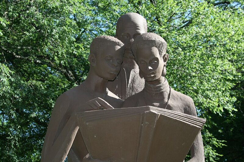 UNCF statute of 3 people reading a book at Morris Brown college