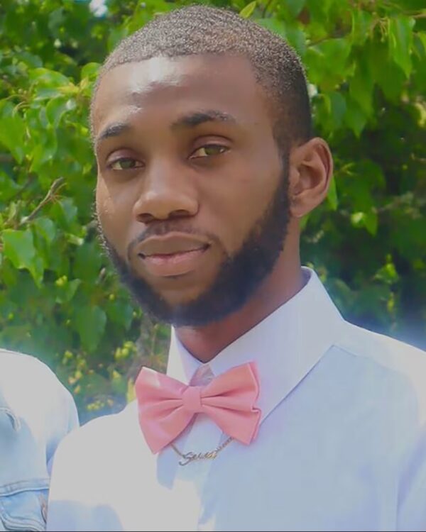 Demartravion "Trey" Reed in a dress shirt and pink bowtie