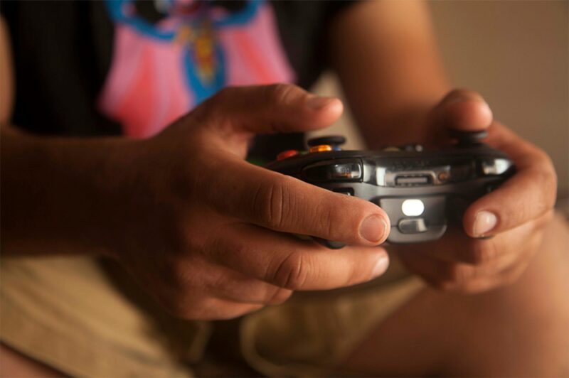 Person holding a video game controller.