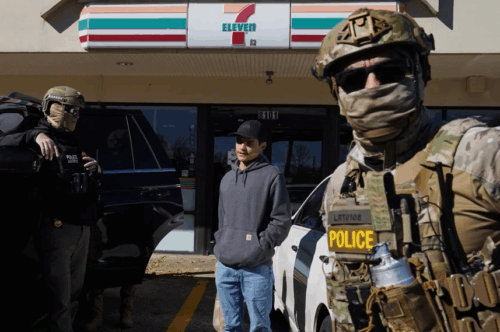 Federal agents question an individual outside of a 7 Eleven in Charlotte, N.C., on Monday.Ryan Murphy / Getty Images