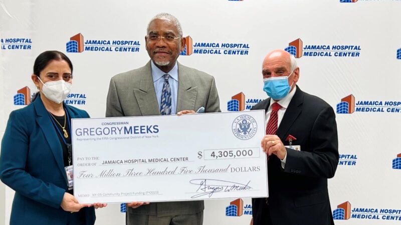 Congressman Meeks holding an oversized check